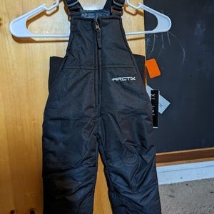 Brand new, tags on. Arctix snowsuit. Size 12m, black.